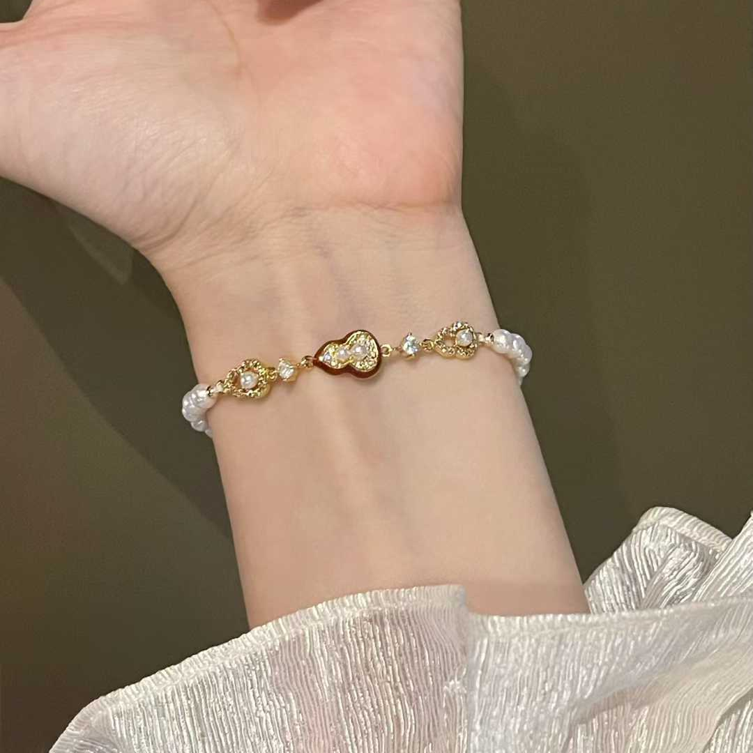 "Crimson Luck" Pearl & Enamel Charm Bracelet