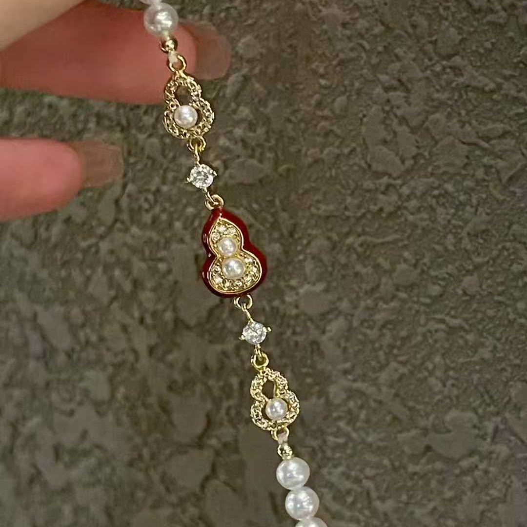 "Crimson Luck" Pearl & Enamel Charm Bracelet