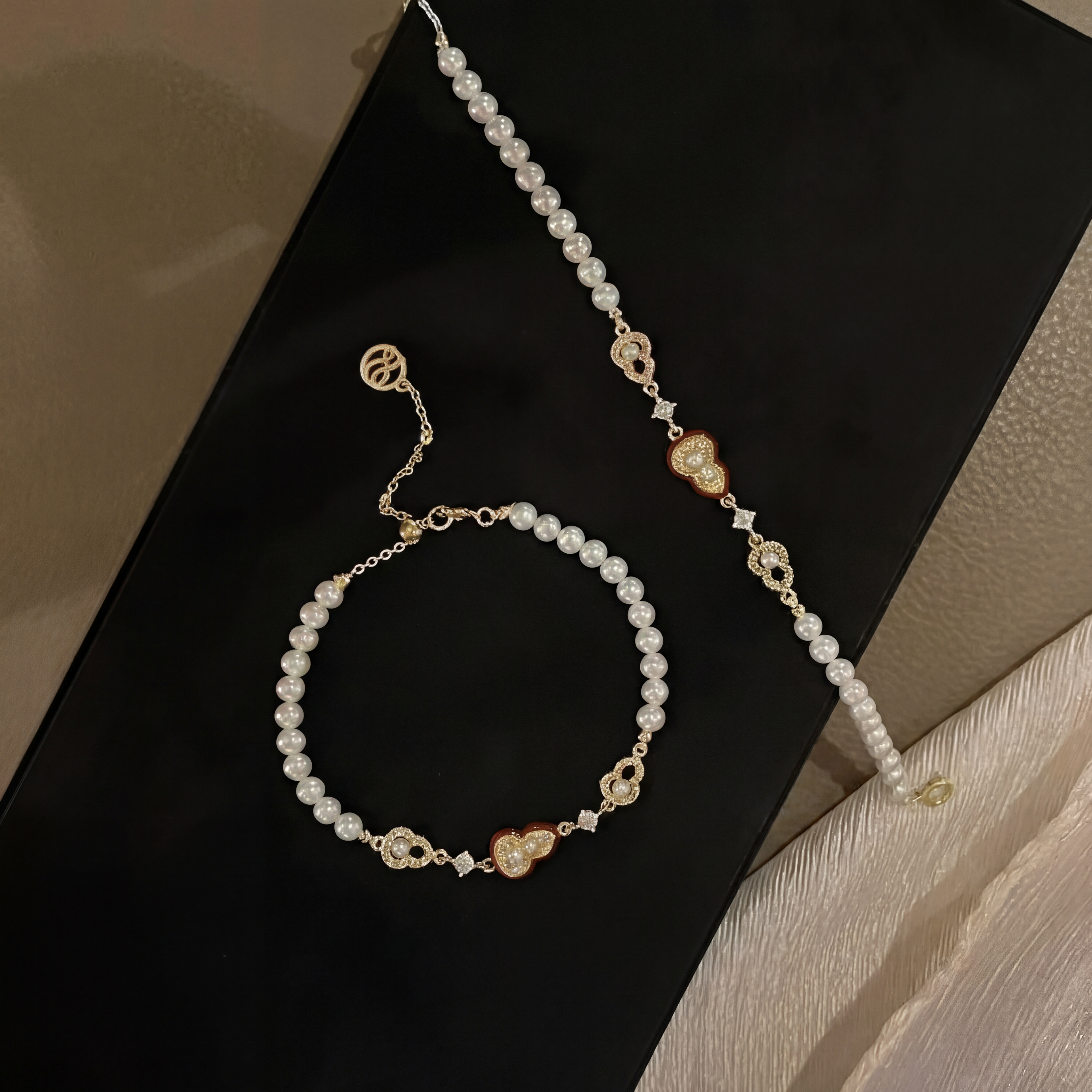 "Crimson Luck" Pearl & Enamel Charm Bracelet